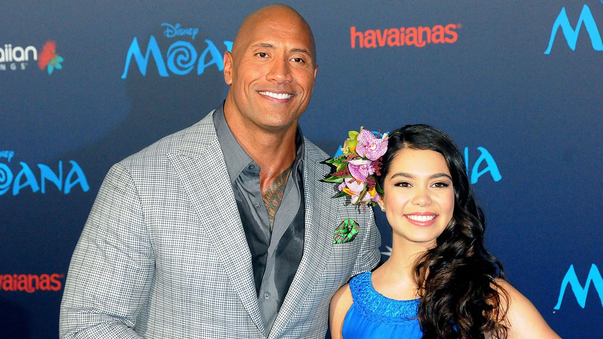 Dwayne Johnson and Auli'i Cravalho posing together