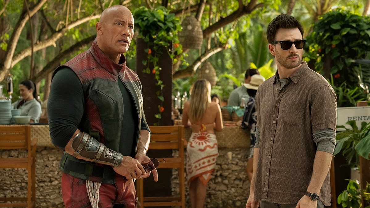 Dwayne Johnson and Chris Evans in a scene from 