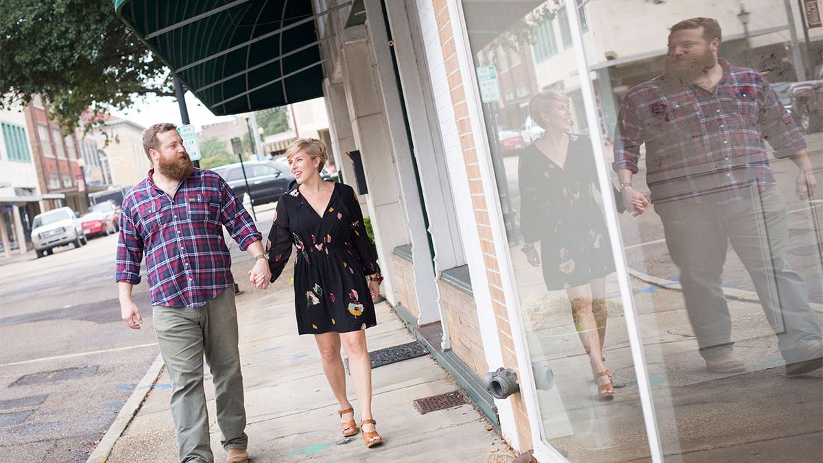 Erin and Ben Napier walking down the street