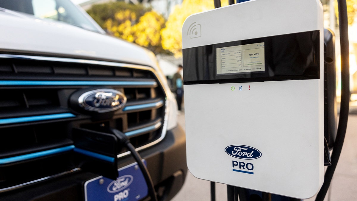 A Ford Pro AC charging station is displayed charging a Ford Transit electric vehicle during the AutoMobility LA 2024 auto show at the Los Angeles Convention Center on Nov. 21, 2024.