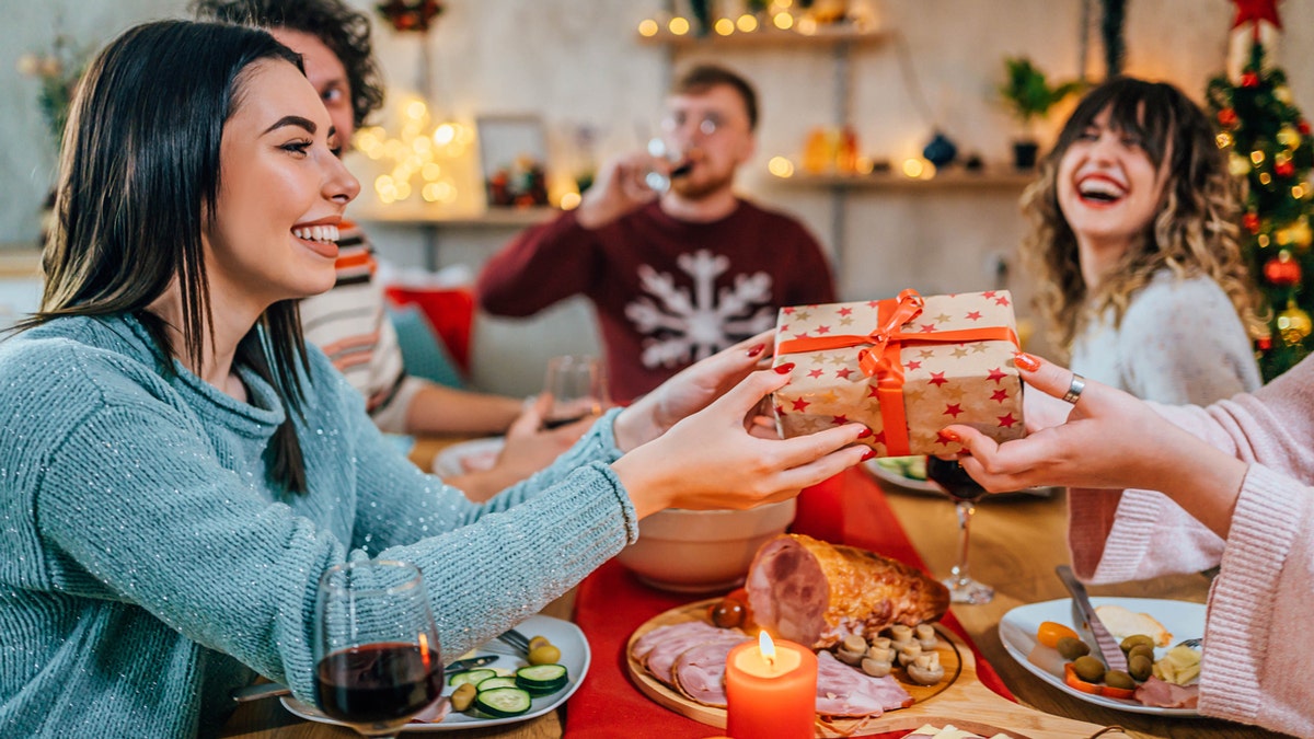 Friends exchanging Christmas gifts