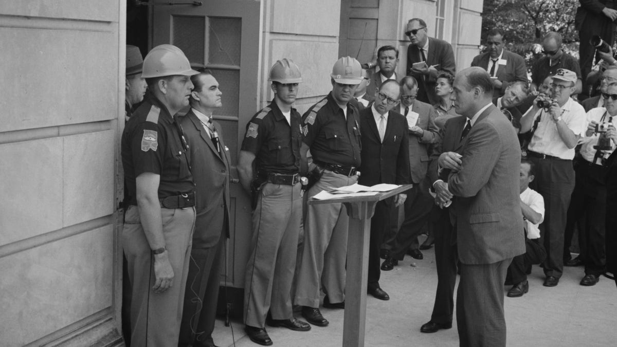 FILE: Alabama Governor George Wallace standing defiantly at a door while being confronted by Deputy U.S. Attorney General Nicholas Katzenbach while attempting to block integration at the University of Alabama in Tuscaloosa, in this June 11, 1963, photograph courtesy of the Library of Congress. REUTERS/Library of Congress/Handout via Reuters