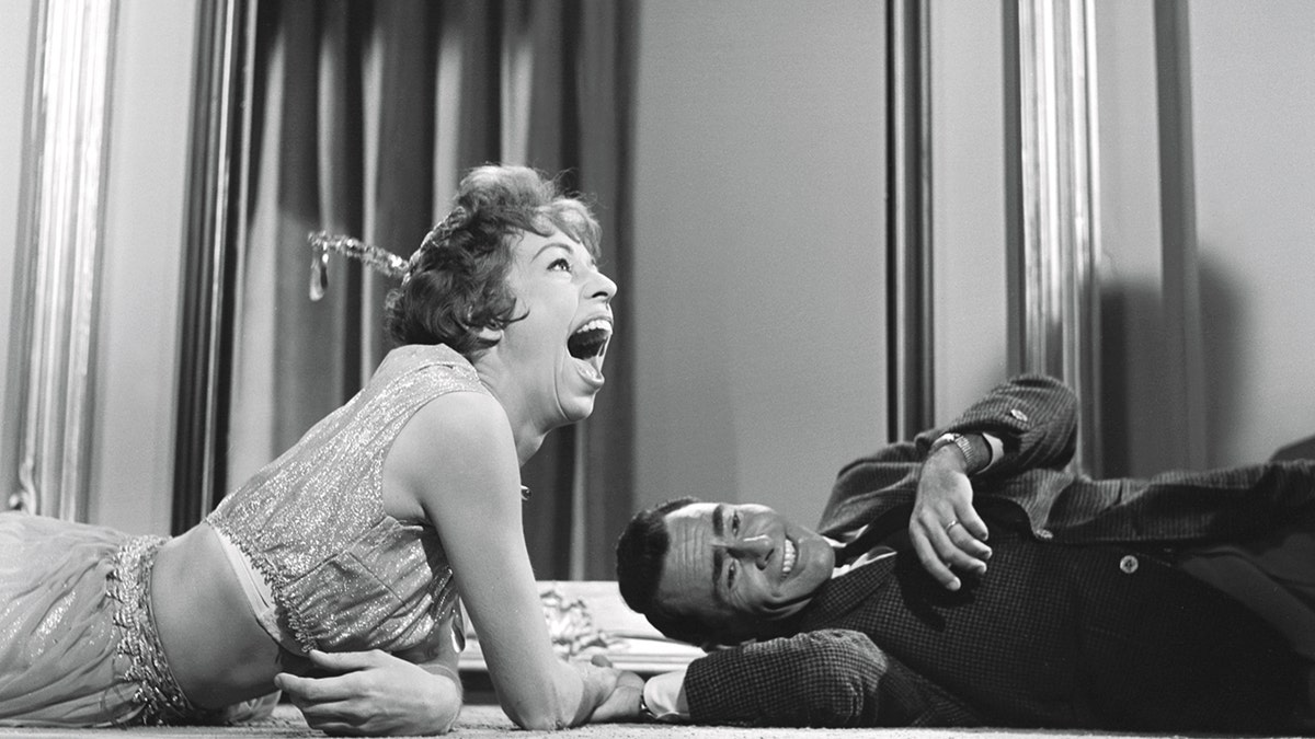 Rod Serling laughing with Carol Burnett