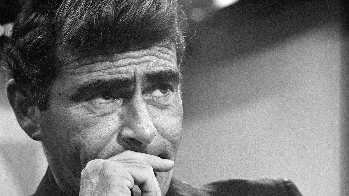 A close-up of Rod Serling looking pensive.