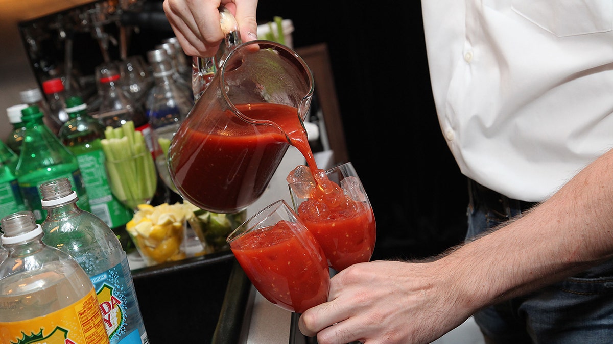 Bloody mary being poured.