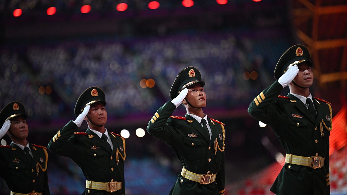 Chinese soldiers salute