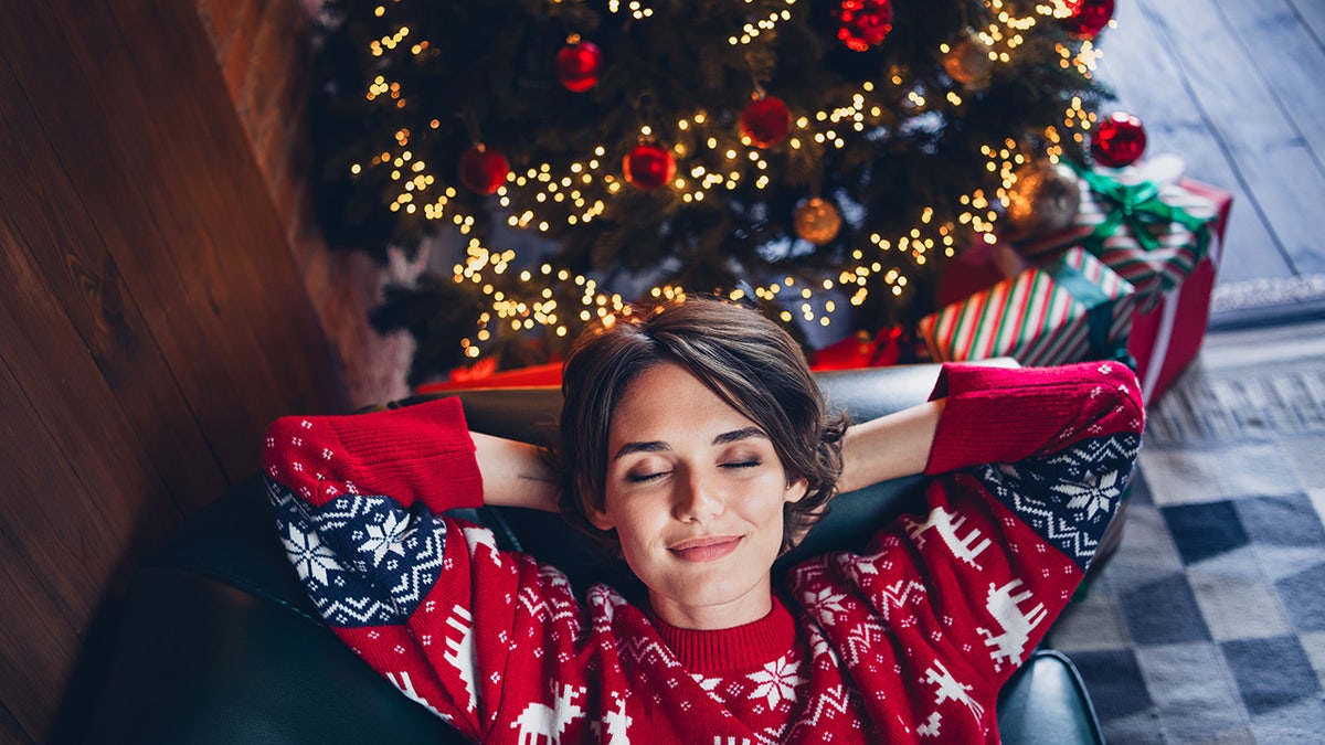 woman sleeping on the couch during christmas