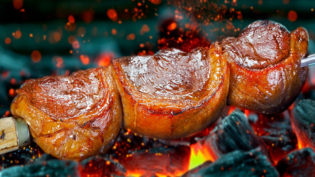 Steak rotisserie at the steakhouse, sliced picanha.