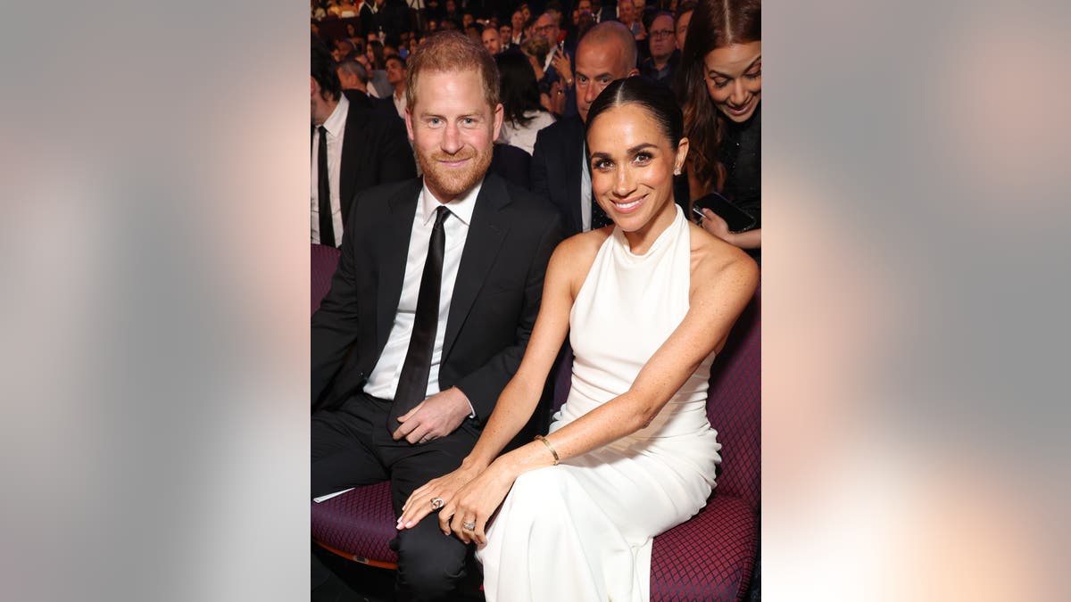 Prince Harry and Meghan Markle smiling