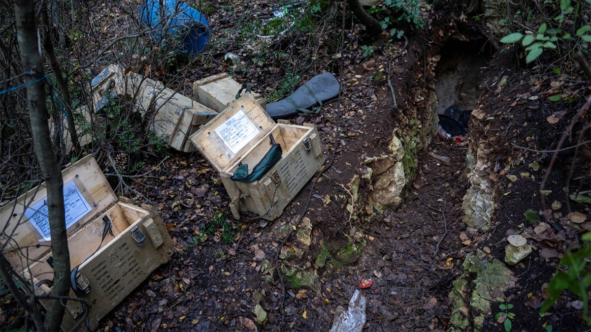 Recovered weapons pictured next to a tunnel in southern Lebanon