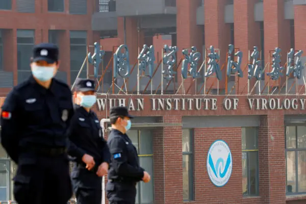 Security personnel keep watch outside the Wuhan Institute of Virology in Wuhan, Hubei Province, China, on Feb. 3, 2021. (Thomas Peter/Reuters)