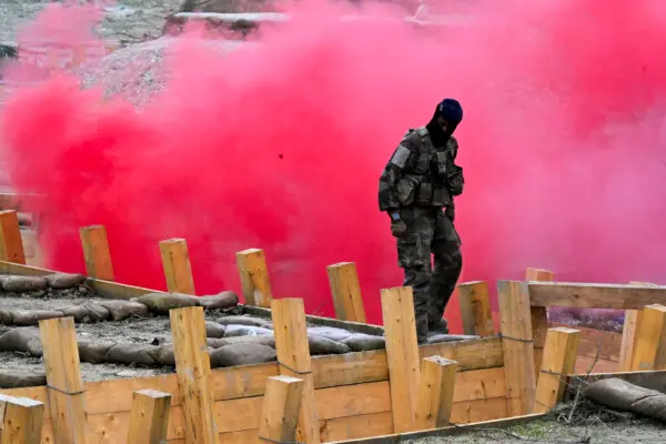 Smoke flares are used as Ukrainian soldiers are trained by the French Army as part of the 