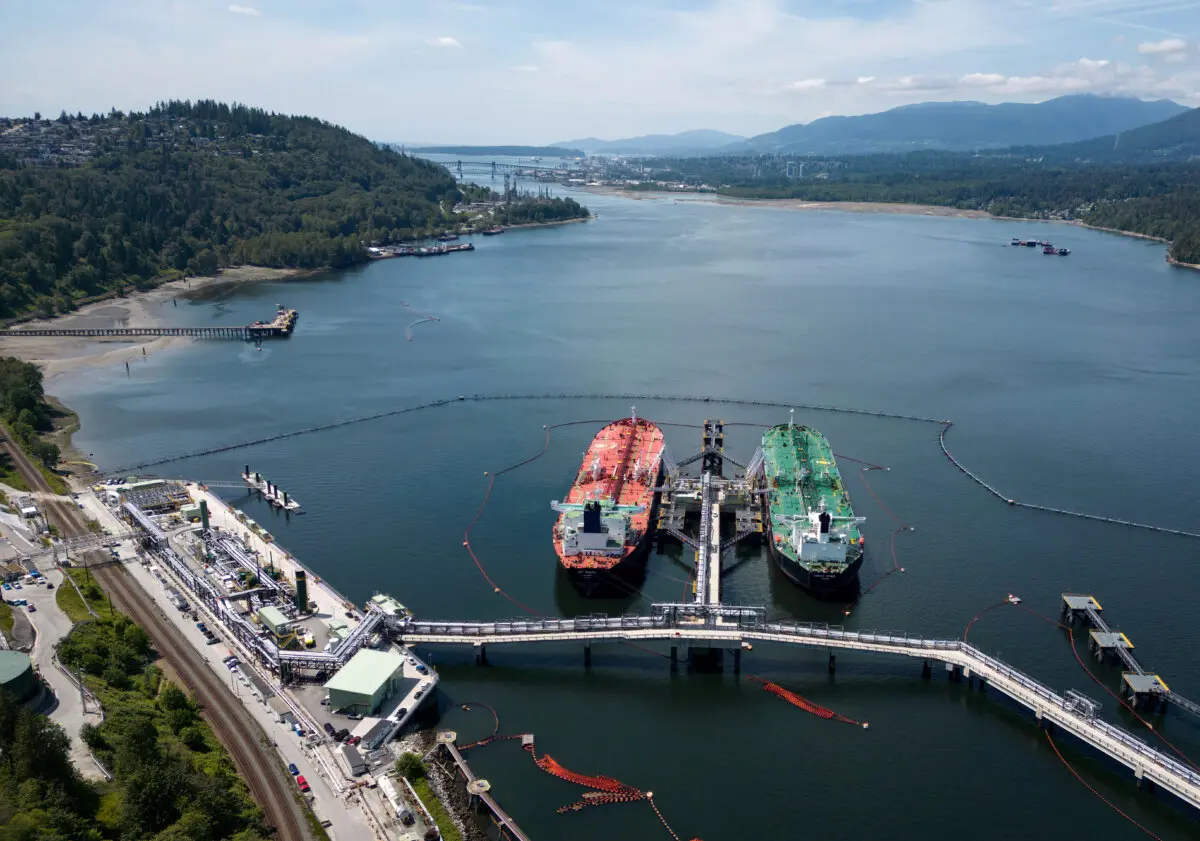 Crude oil tankers are docked at the Trans Mountain Westridge Marine Terminal in Burnaby, B.C., on June 10, 2024. (Darryl Dyck/The Canadian Press)