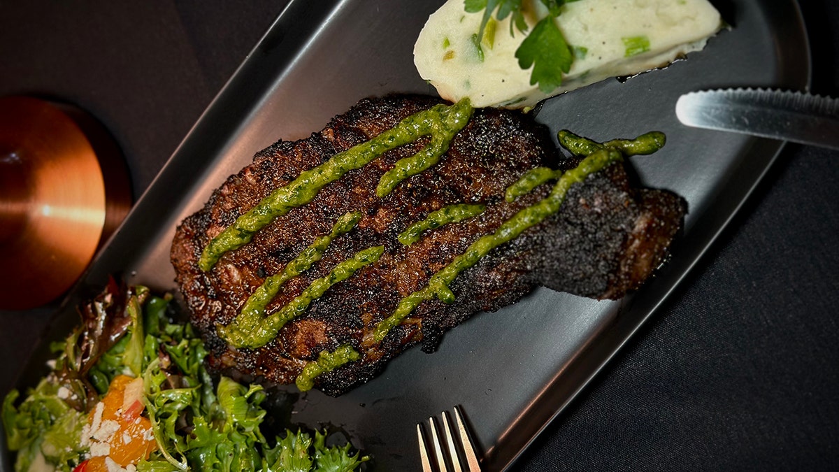 Plate of steak with mashed potatoes in a heart