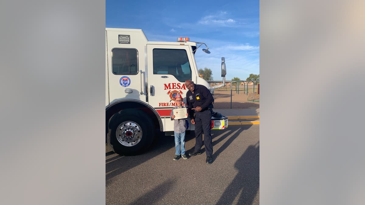 Thomas Conley with firefighter