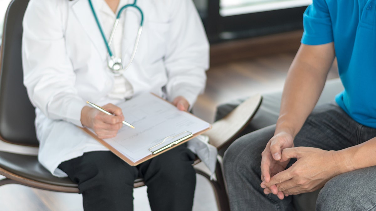 doctor seated with patient