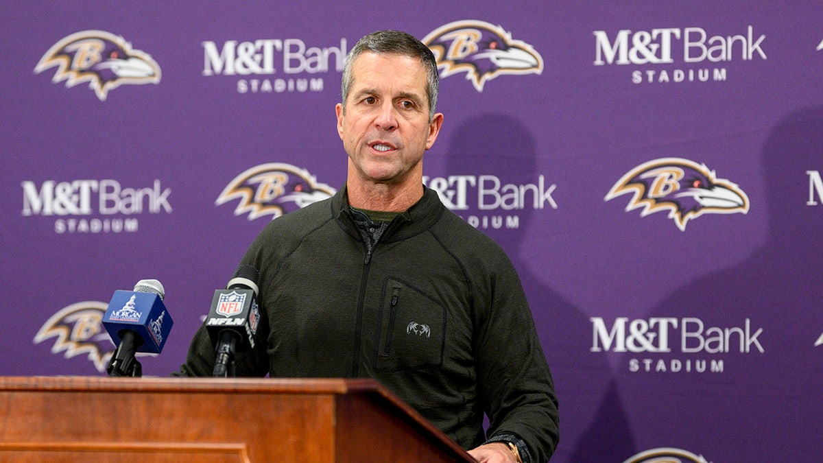 John Harbaugh talks to repoters