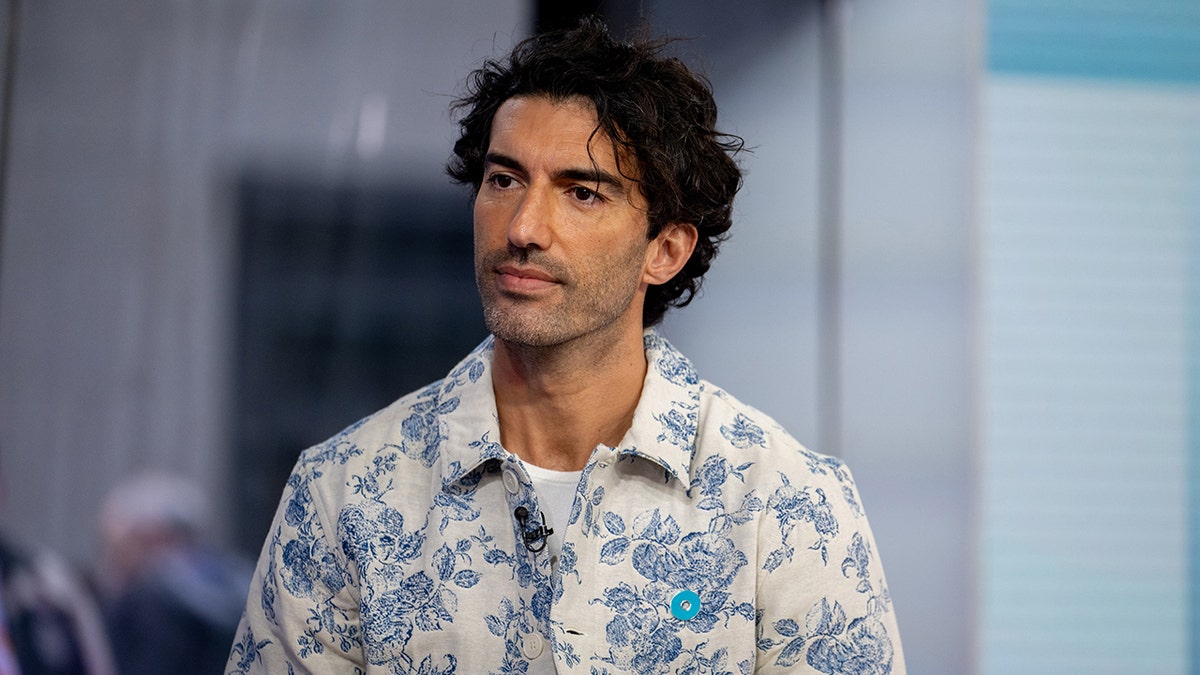 Justin Baldoni wears a floral jacket