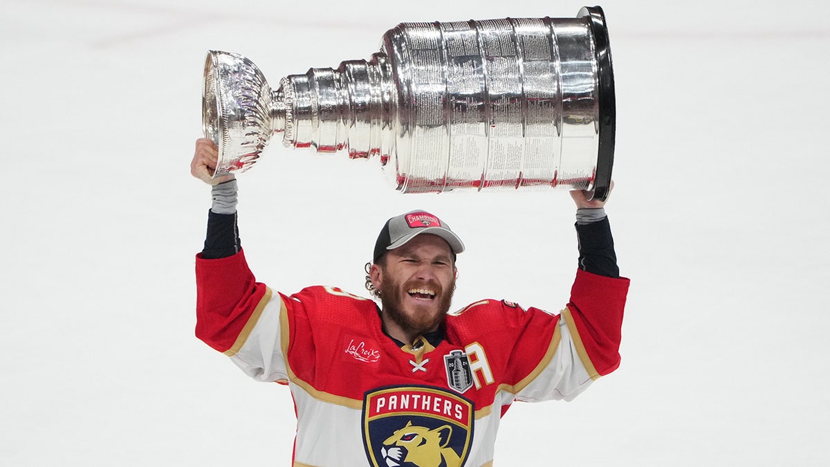 Matthew Tkachuk hoists cup