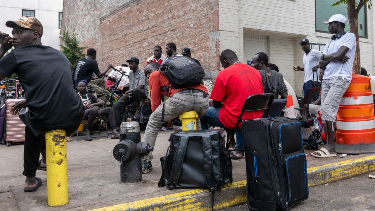 Migrants outside of two shelters in Brooklyn