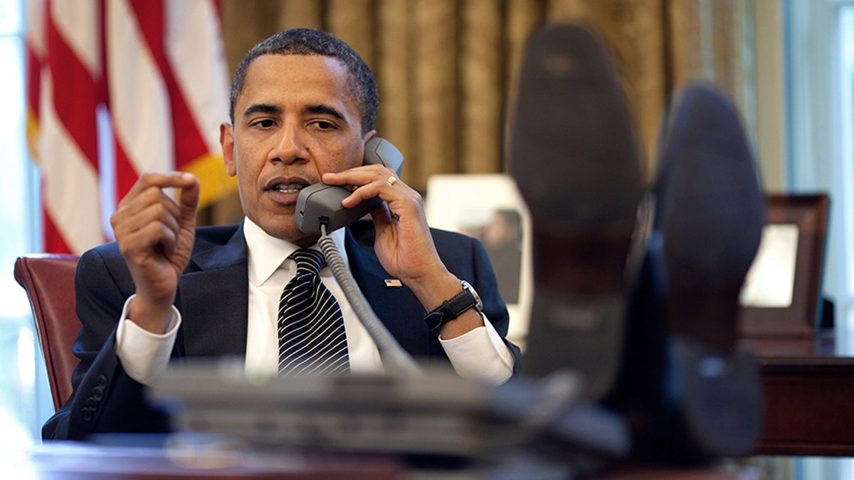 President Barack Obama talks with Israeli Prime Minister Benjamin Netanyahu during a phone call from the Oval Office, Monday, June 8, 2009. Official White House Photo by Pete Souza.This official White House photograph is being made available for publication by news organizations and/or for personal use printing by the subject(s) of the photograph. The photograph may not be manipulated in any way or used in materials, advertisements, products, or promotions that in any way suggest approval or endorsement of the President, the First Family, or the White House.