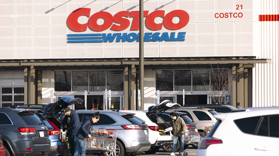 Outside a NJ Costco shoppers load their cars