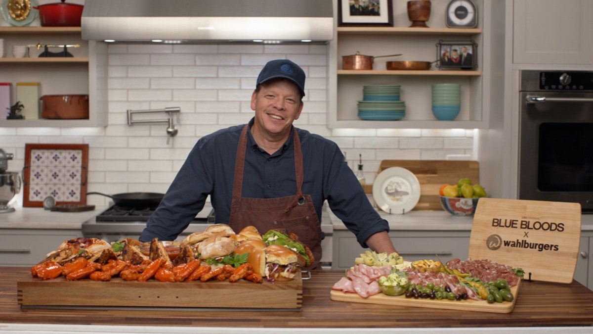 Paul Wahlberg poses with his smorgasbord created for the series finale of 