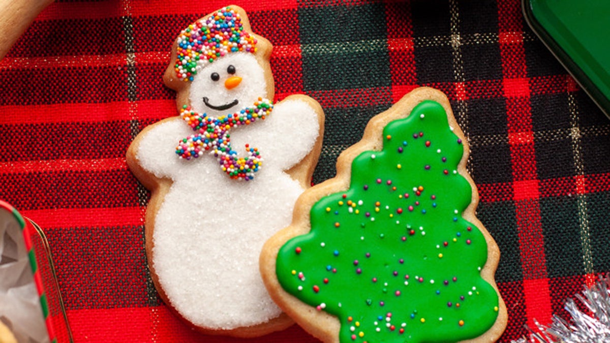 snowman and tree sugar cookies gingham background