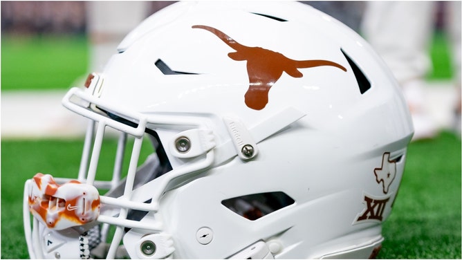 A Texas Longhorns fan with a wild look set the internet on fire after being spotted during the game against Georgia. Check out the reactions. (Credit: Getty Images)