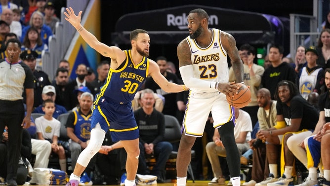 Golden State Warriors' Steph Curry defends Los Angeles Lakers' LeBron James at Chase Center. (Darren Yamashita-Imagn Images)