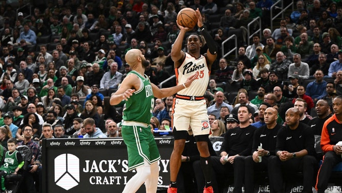 Detroit Pistons SG Jaden Ivey shoots a 3-pointer over Boston Celtics SG Derrick White at the TD Garden. (Brian Fluharty-Imagn Images)