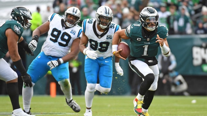 Philadelphia Eagles QB Jalen Hurts runs away from the Carolina Panthers at Lincoln Financial Field in NFL Week 14. (Eric Hartline-Imagn Images)