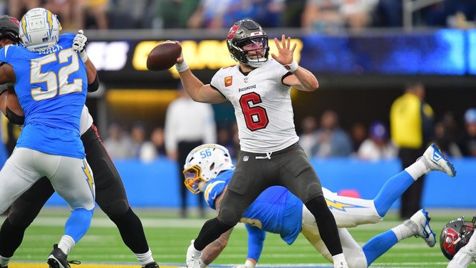 Tampa Bay Buccaneers QB Baker Mayfield throws the ball vs. the Los Angeles Chargers in NFL Week 15 at SoFi Stadium. (Gary A. Vasquez-Imagn Images)