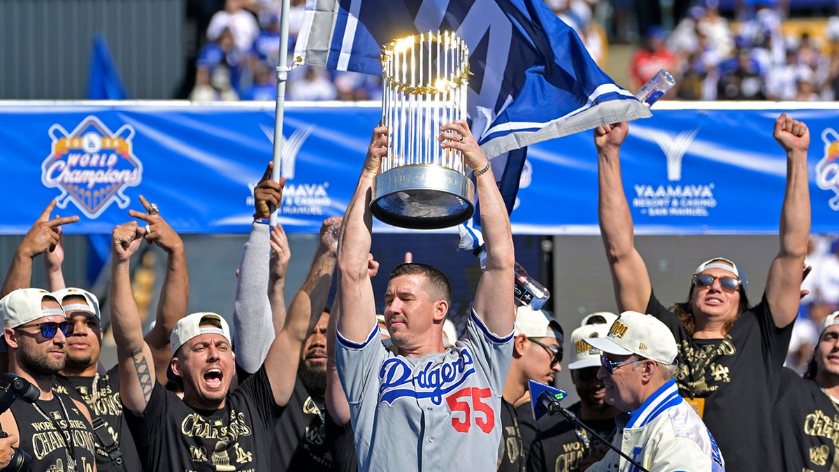 Walker Buehler raises World Series trophy