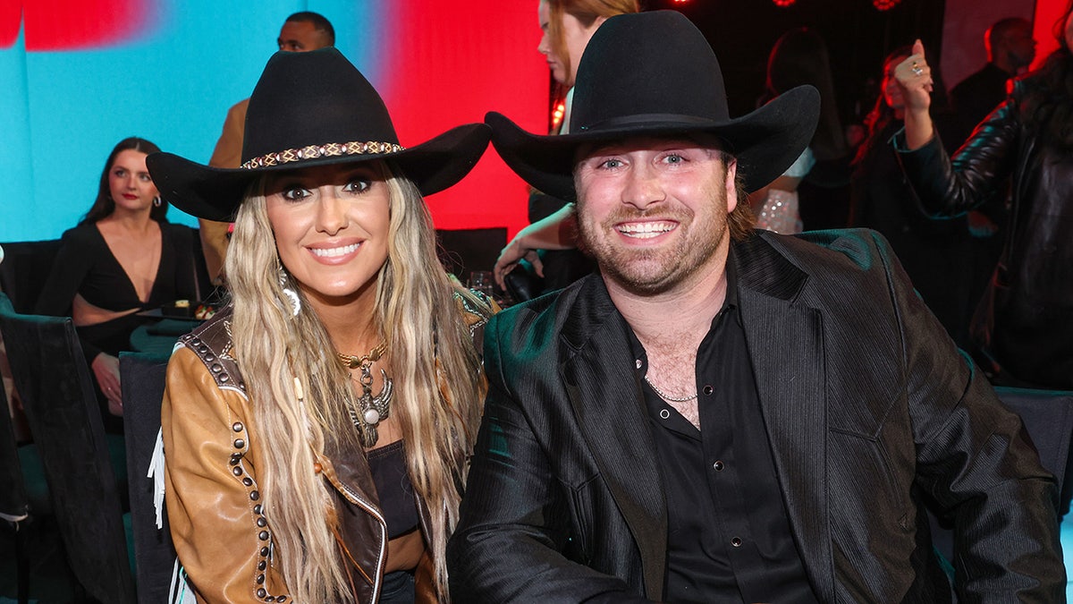 Lainey Wilson and her boyfriend attend an awards show