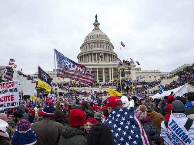 FILE - Rioters loyal to President Donald Trump rally at the U.S. Capitol in Washington, Ja