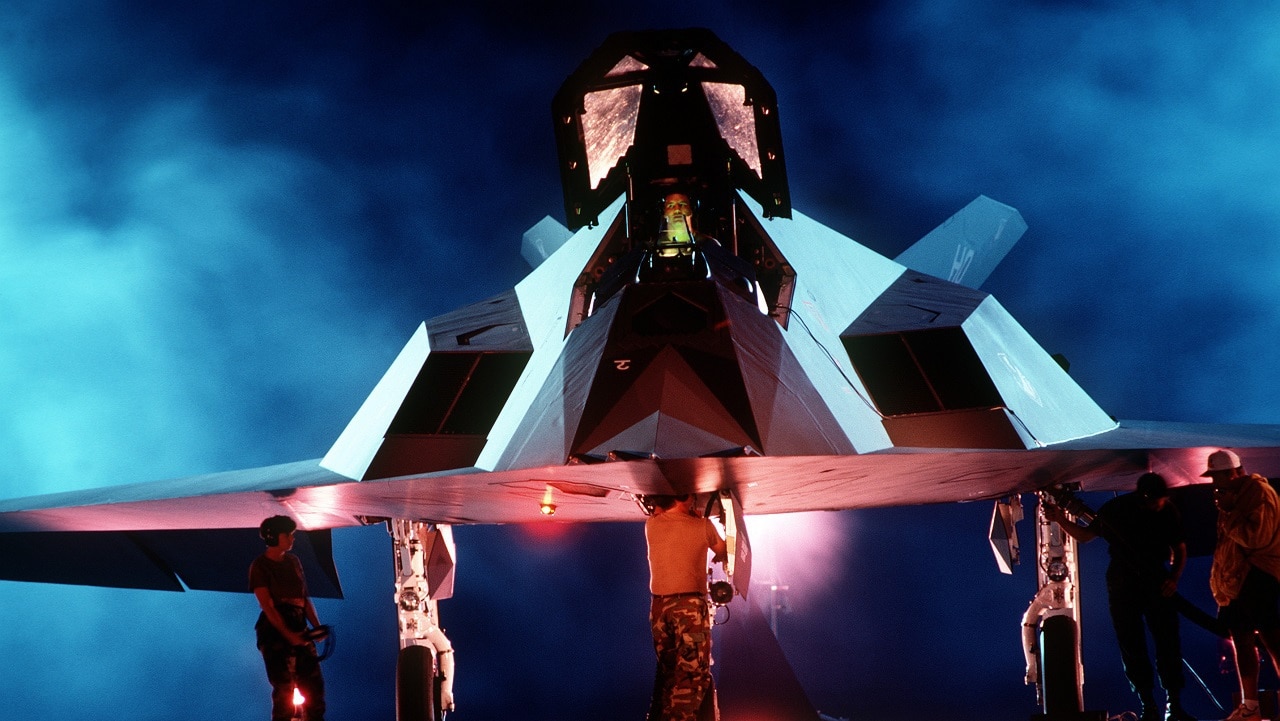 A back lit front view of a F-117A Stealth Fighter aircraft. From Airman Magazine's February 1995 issue article 