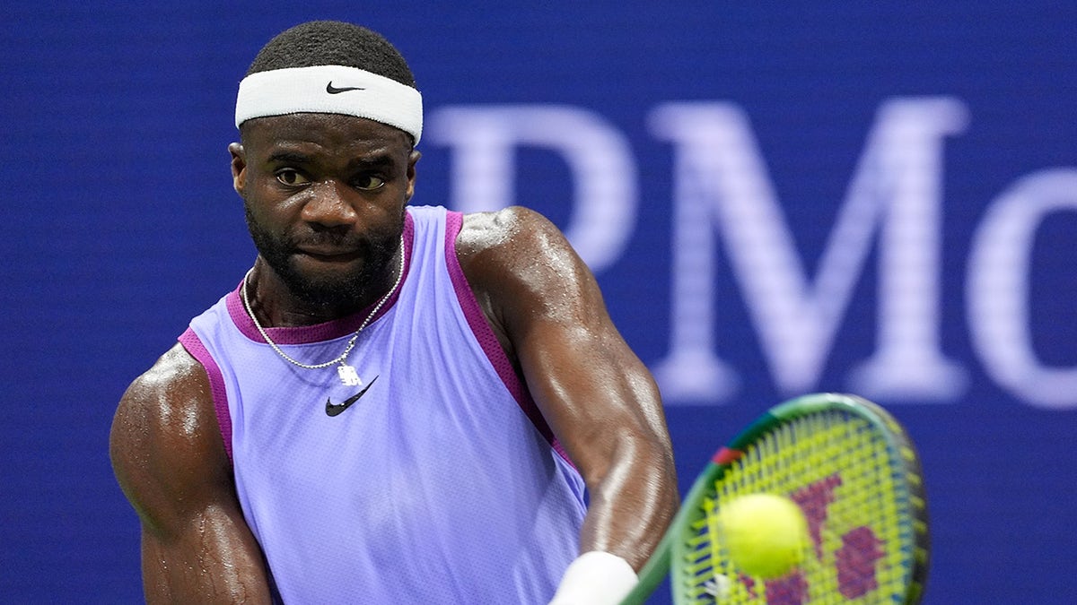 Frances Tiafoe plays shot