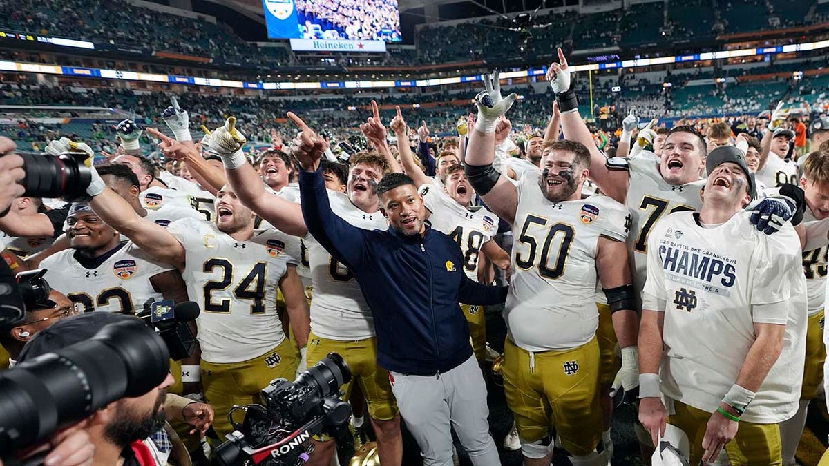 Marcus Freeman celebrates with players