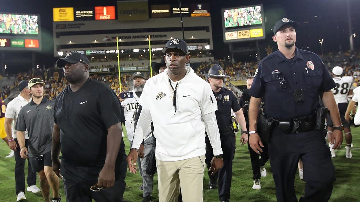 Deion Sanders walks off the field