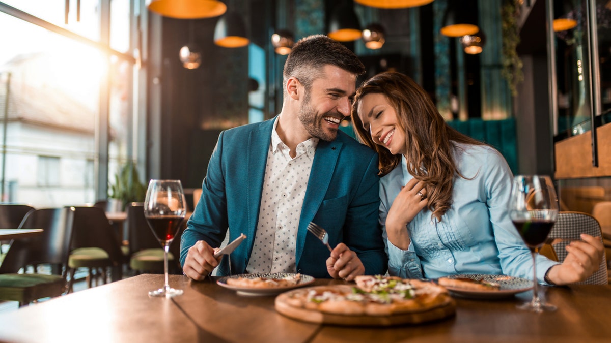 Two people eating at a restaurant