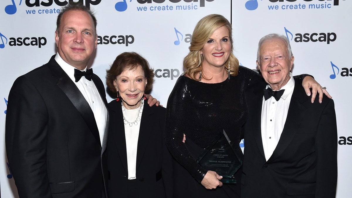 Garth Brooks, Trisha Yearwood and the Carters attend an event