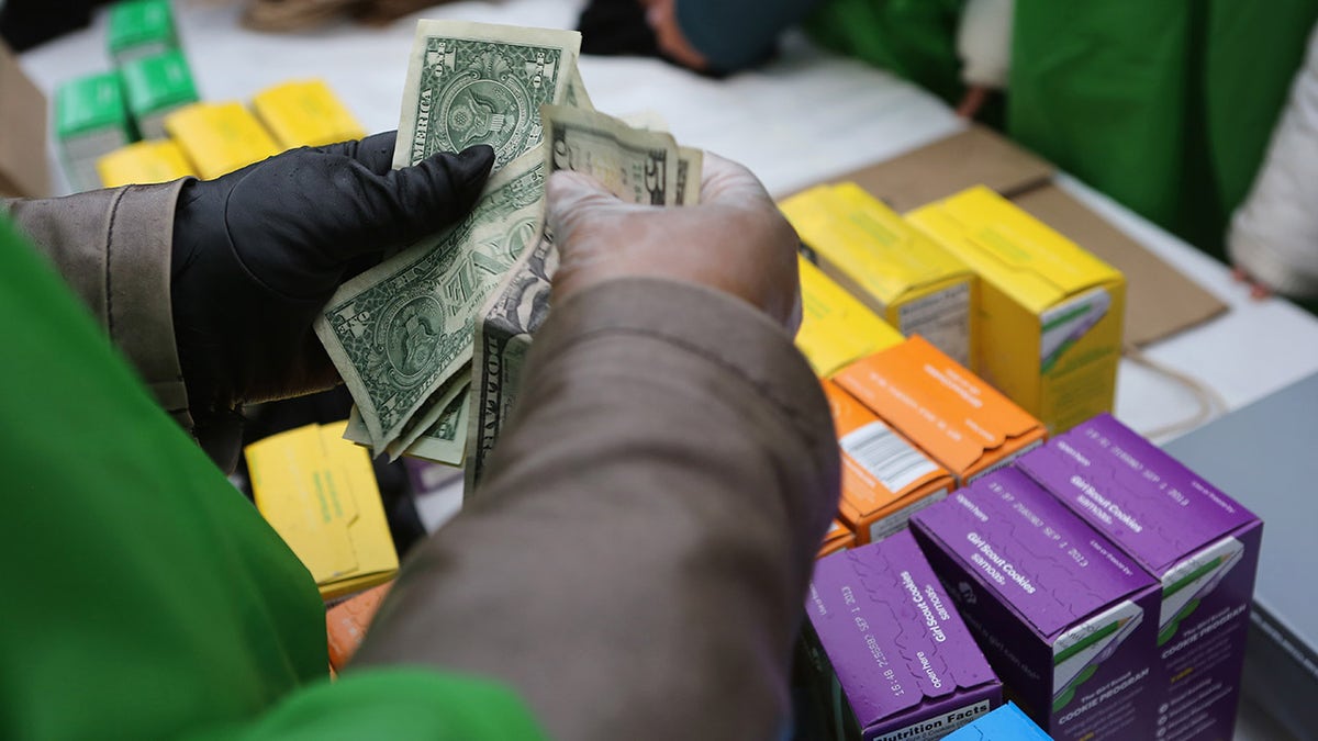 Person selling Girl Scout cookies.