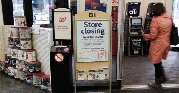 A sign informs customers that a Walgreens pharmacy and convenience store would soon be closing in New York City. (Spencer Platt/Getty Images)