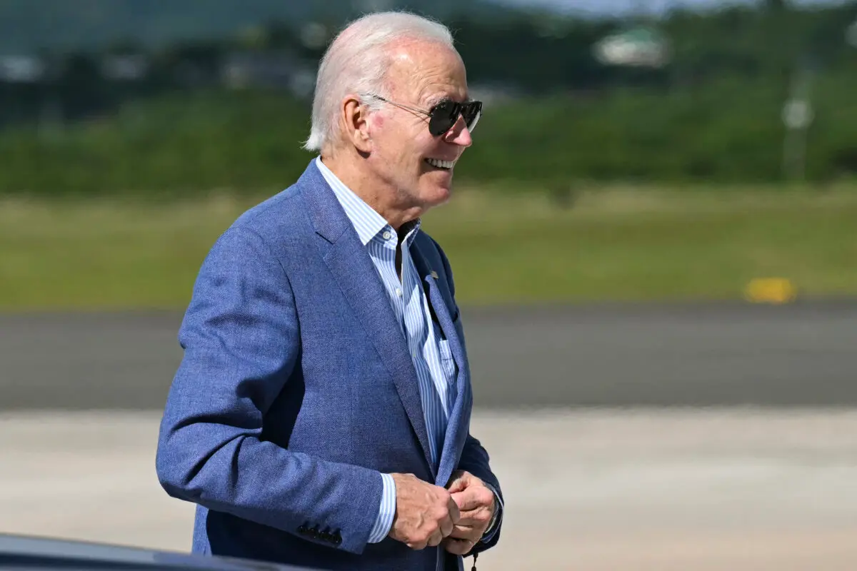 U.S. President Joe Biden walks to board Air Force One at Henry E. Rohlsen Airport in Christiansted, St. Croix, on the U.S. Virgin Islands, on Dec. 31, 2024. (Saul Loeb/AFP via Getty Images)