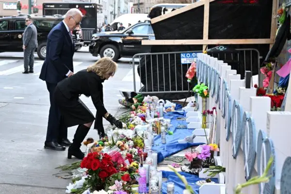 President Joe Biden and First Lady Jill Biden lay flowers as they pay their respects to victims of the Jan. 1 truck attack at a makeshift memorial in Bourbon Street in New Orleans, La., on Jan. 6, 2025. (Roberto Schmidt/AFP)