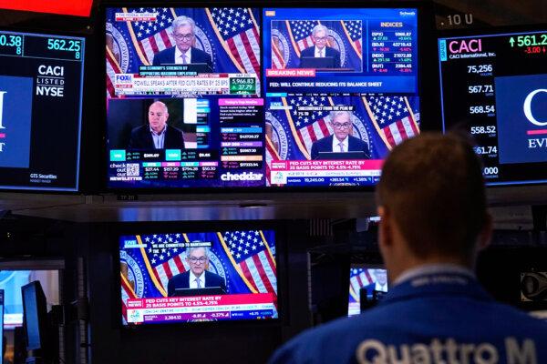 Comments by Federal Reserve Chair Jerome Powell appear on a bank of screens on the floor of the New York Stock Exchange on Nov. 7, 2024. (Richard Drew/AP Photo)