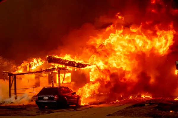 The Eaton Fire engulfs a property in Altadena, Calif., on Jan. 8, 2025. (Ethan Swope/AP Photo)