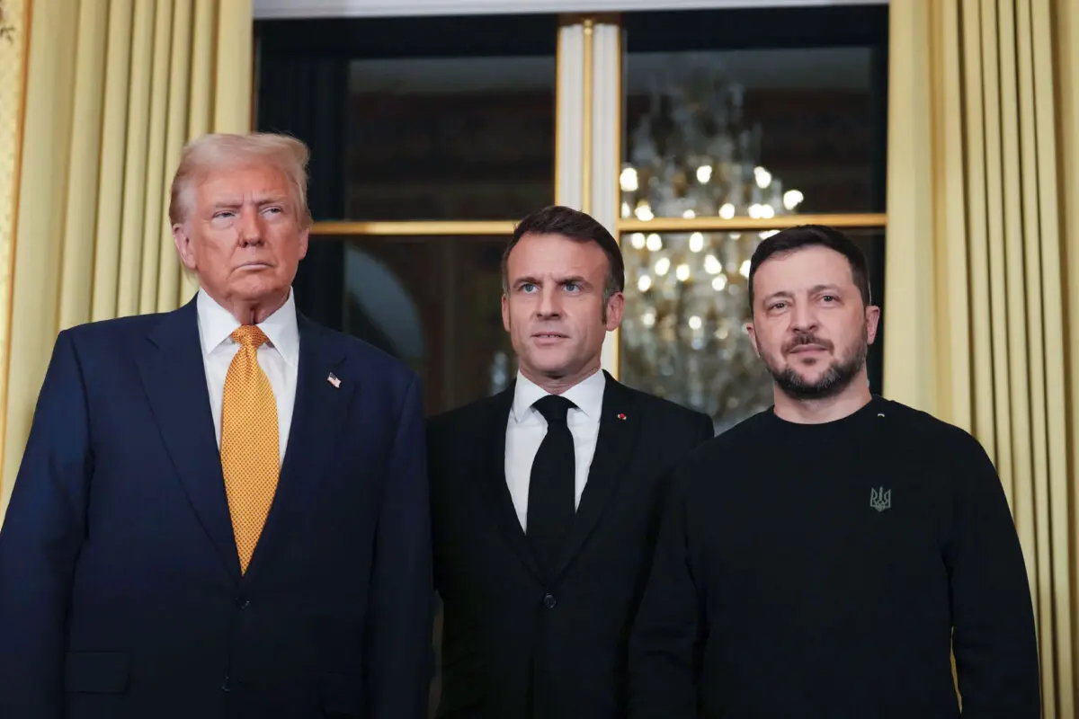 French President Emmanuel Macron (C) poses with U.S. President-elect Donald Trump (L) and Ukrainian President Volodymyr Zelenskyy (R) at the Elysee Palace in Paris on Dec. 7, 2024. (Aurelien Morissard/AP Photo)