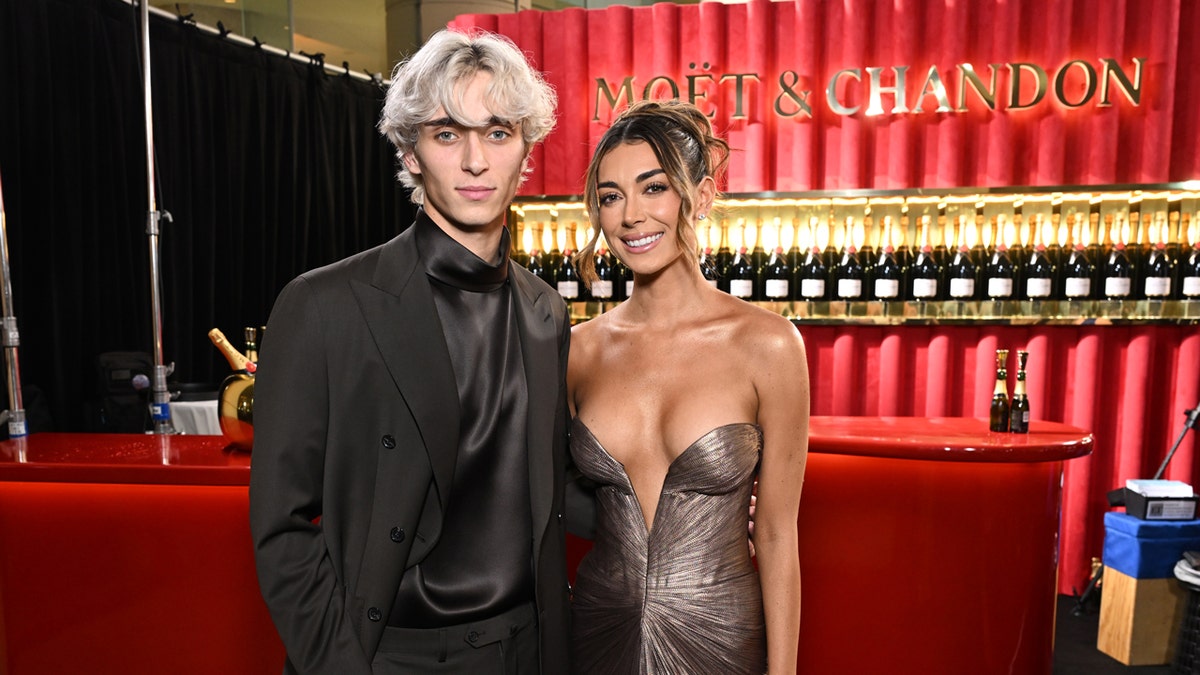 Josh Richards and Brianna LaPaglia attend Golden Globes